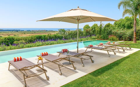 Villa Smeraldo - Sea Front | By Rocco Forte Villas: Mueble, Propiedad, Planta, Cielo, Paraguas, Mesa, Sombra, Azur, Mueble Para Exteriores, Árbol
