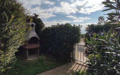 Casa Gavina With Garden Alghero: Cielo, Arbusto, Jardín, Mañana, Luz De Sol, Paisajismo, Yarda, Patio Interior, Noche