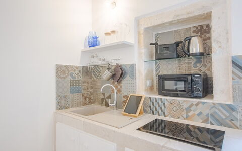 Casa Bolero: Piso, Diseño De Interiores, Suelo, Loseta, Mostrador, Cocina, Mosaico, Cerámico, Lámpara, Electrodoméstico